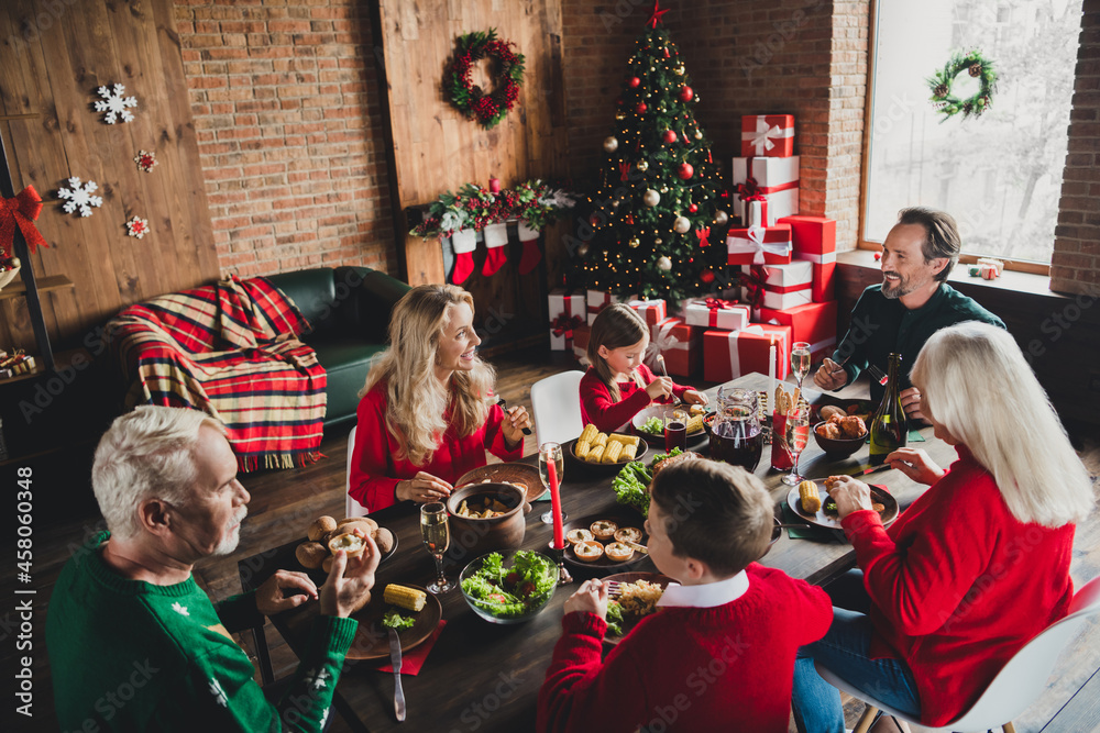 Photo of family small childhood grandchildren pensioner retired grandparents friends noel sit big table wife husband x-mas indoors house Photo of family small childhood grandchildren pensioner retired grandparents friends noel sit big table wife husband x-mas indoors house