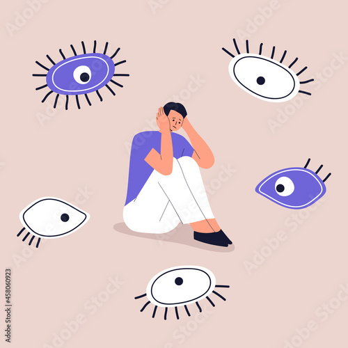 Concept of paranoia, persecution mania, phobias and mental disorders. A frightened man sits and holds his head with his hands. The eyes look at the guy from all sides. Vector. Eps 10.