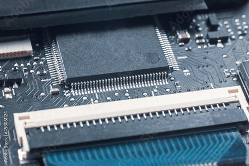 Laptop motherboard close up with resistors transistors