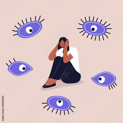Concept of paranoia, persecution mania, phobias and mental disorders. A frightened black girl sits and holds her head with her hands. The eyes look at the girl from all sides. Vector. Eps 10.