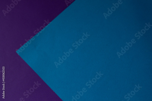 blue paper on a background of purple paper. colored background