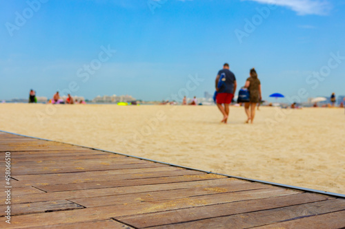 Background of people walking on the beach on sunny day © fotofabrika