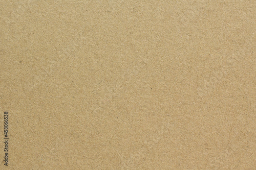 Brown craft cardboard paper sheet of recycle paper background and texture.