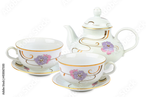 Vintage porcelain teapot and tea cups with saucers isolated on white