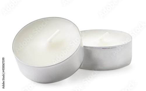 Small round candles on a white background. Isolated