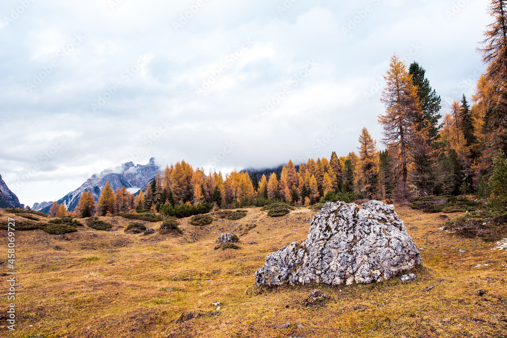 mystical landscape with big stone and fog over the mountains near in Dolomites Alps. (Meditation, anti-stress, relaxation - concept)