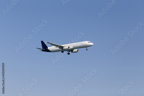 white passenger airlane flying in the sky