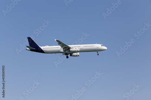 white passenger airlane flying in the sky