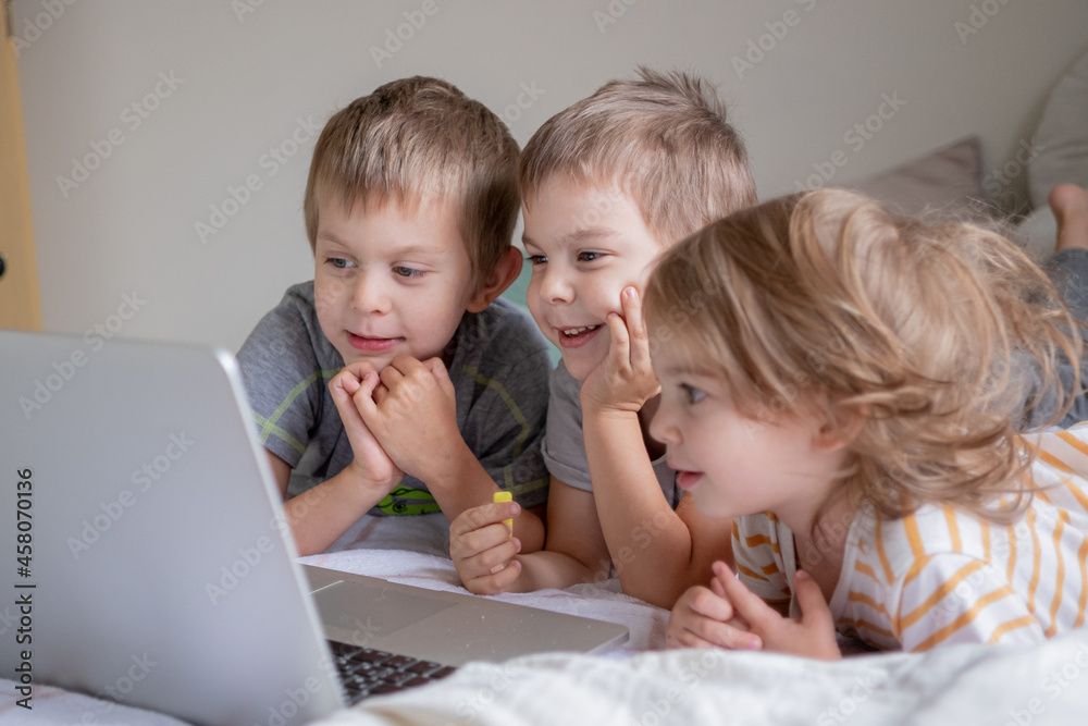 Little kids having video chat via laptop at home Little kids having video chat via laptop at home
