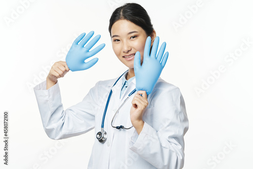 asian woman in medical gown rubber gloves hospital