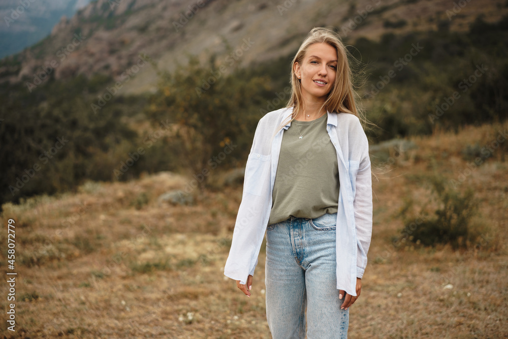 Beautiful young blonde woman in the mountains Beautiful young blonde woman in the mountains