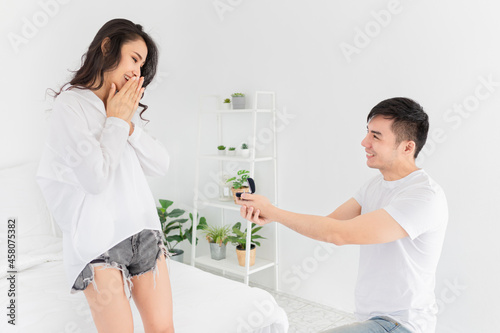 asian man want to propose to his girlfriend, he show wedding ring, asian lover feeling happy in valentine's day, love forever