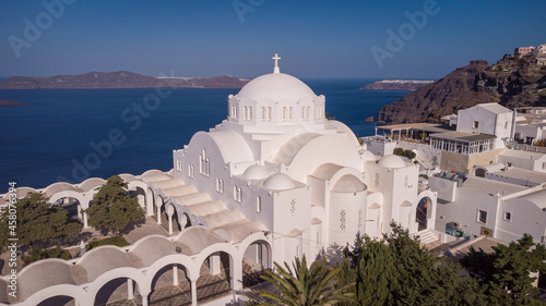 church with a dome on the coast from the drone. Thira Santorini Greece