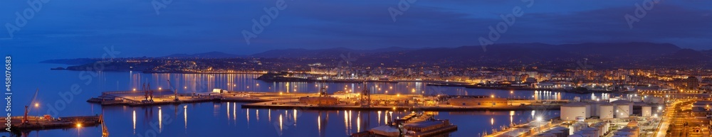 Panoramic view of the port of Musel with the city of Gijón behind