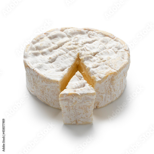 Traditional single French Camembert cheese and a piece isolated on white background 