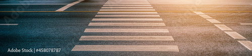 Crosswalk on the road for safety when people walking cross the street  Pedestrian crossing on a repaired asphalt road  Crosswalk on the street for safety  logistic import export and transport industry