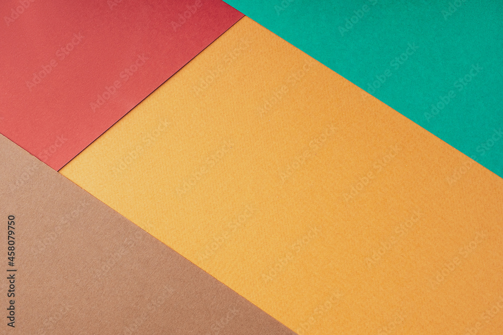 Geometric abstract composition made of colored paper, flat, lay, top view, copy space. Autumn background in warm bright red-brown shades. Creative minimal layout design. Paper texture Geometric abstract composition made of colored paper, flat, lay, top view, copy space. Autumn background in warm bright red-brown shades. Creative minimal layout design. Paper texture