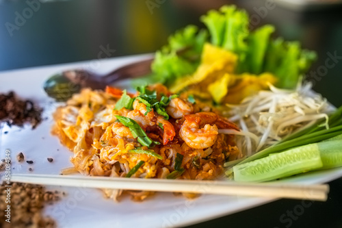 Pad thai. Padthai is a very famous Thai food & popular among the foreigner tourists. Ingredients including fresh prawns, eggs, beansprouts & tofu.