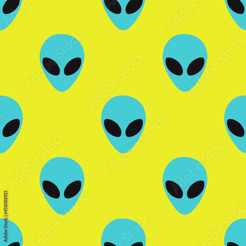 
The face of an alien on a yellow seamless background, print of a creature from another planet.