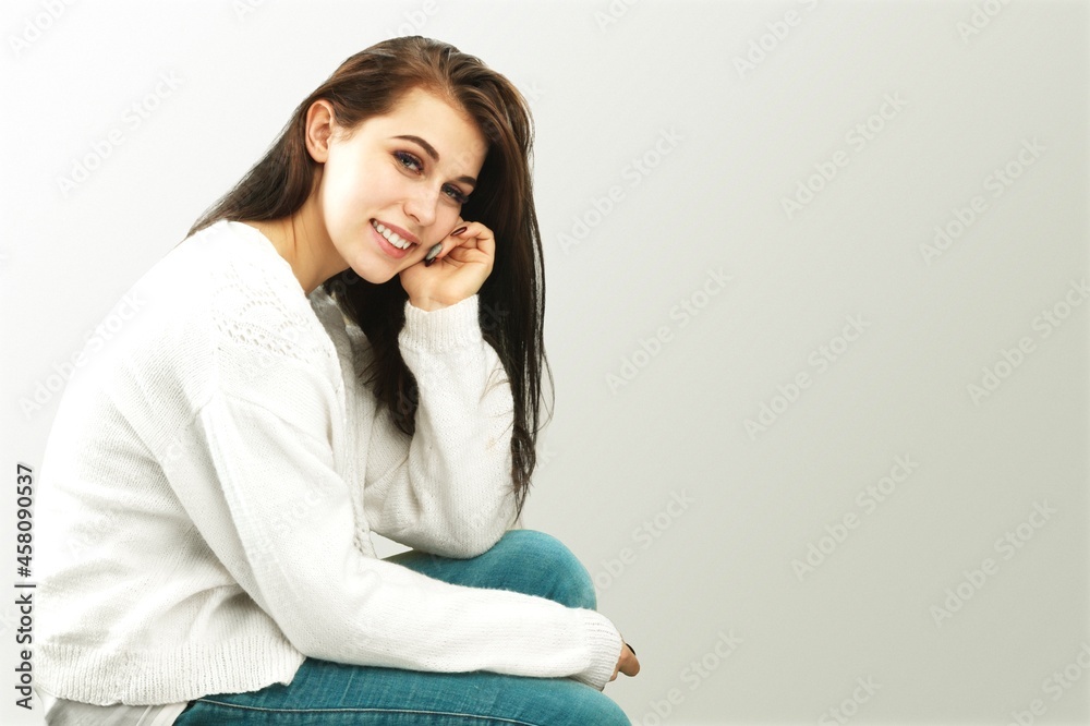 A young happy woman smiling and posing A young happy woman smiling and posing