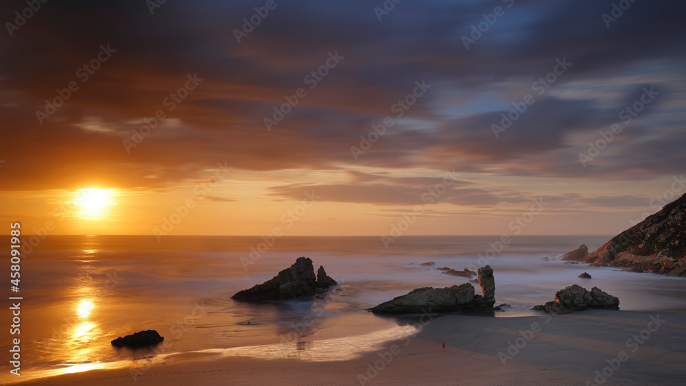 Photography of a long exposure in a sunset in the Playón de Bayas, Asturias, Spain Photography of a long exposure in a sunset in the Playón de Bayas, Asturias, Spain