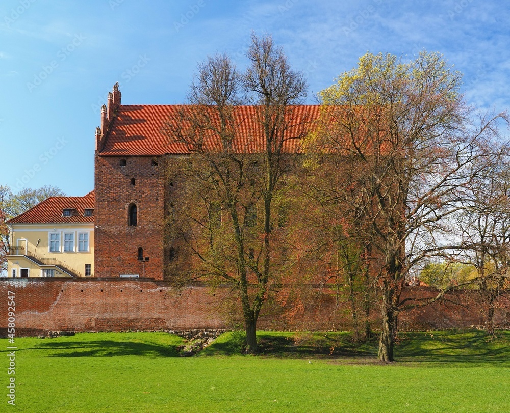 Side of the medieval castle made of red brick