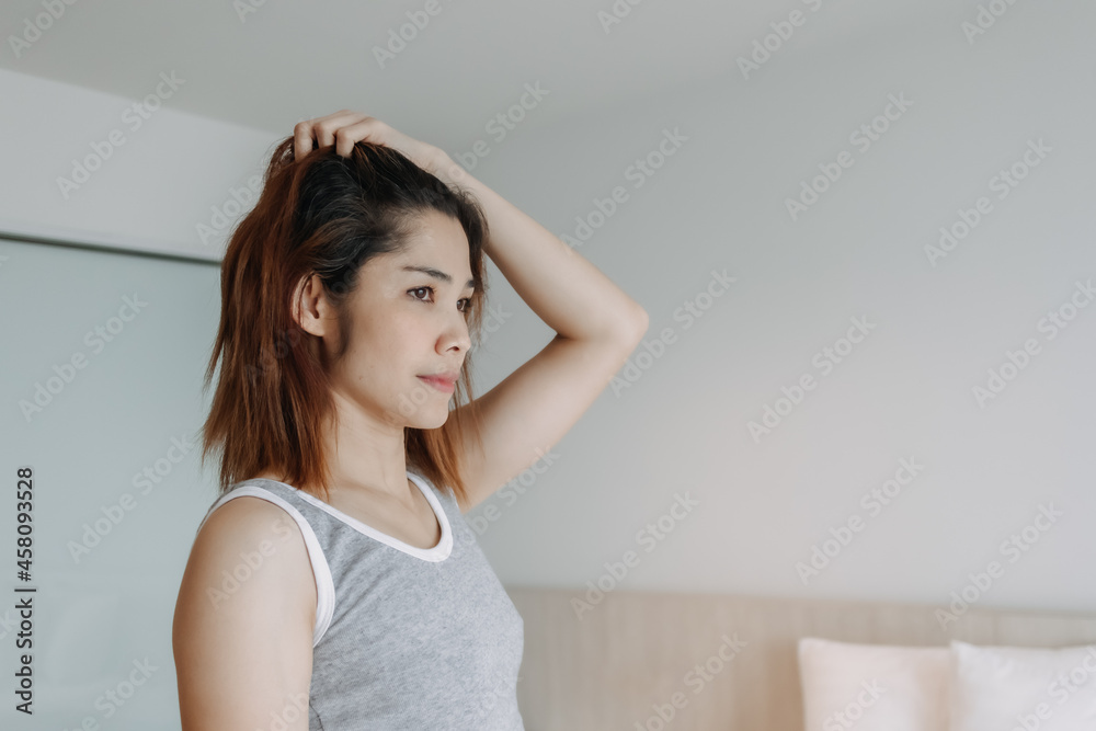 Attractive and funny Asian woman just wake up on the bed. Attractive and funny Asian woman just wake up on the bed.
