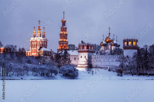 View of the architectural ensemble of the Novodevichy convent on a winter evening. Moscow, Russia
