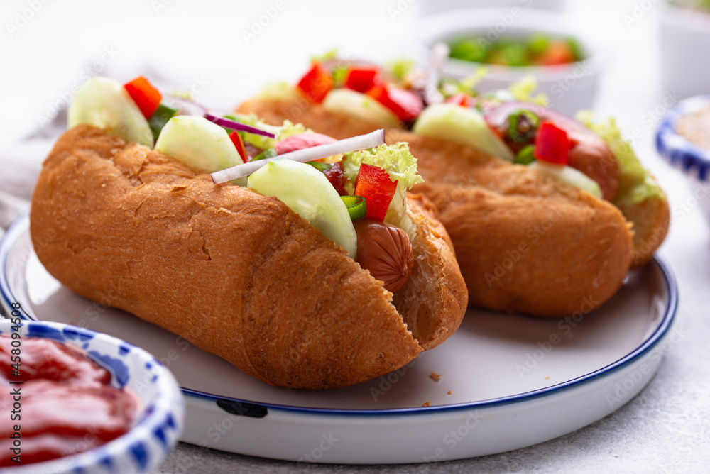 Hot dogs with sausage, sauces and vegetables Hot dogs with sausage, sauces and vegetables