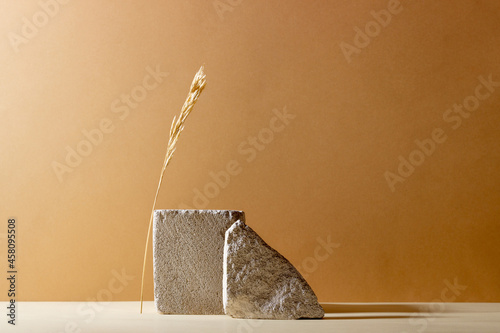 Background with geometric shapes made of concrete for cosmetic products. Rectangular podiums with shadows on a beige background. Blank mockup for product packaging presentation