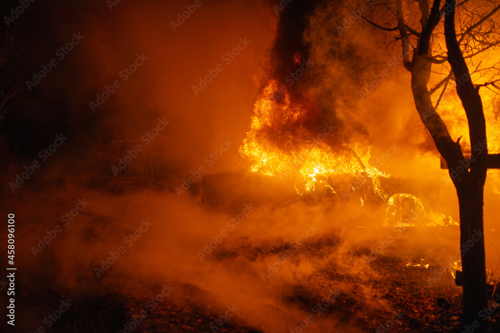 Burning car accident at night