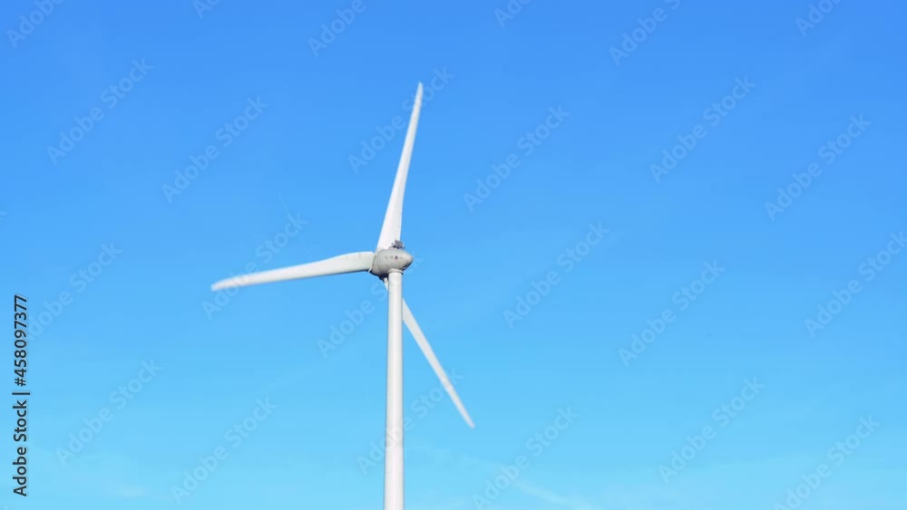 Wind turbine against blue sky, Niagara Region Wind Farm 230 MW of electricity Wind turbine against blue sky, Niagara Region Wind Farm 230 MW of electricity