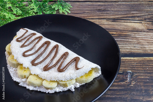 Tapioca, typical of northeastern Brazil, banana with chocolate and hazelnut cream. photo