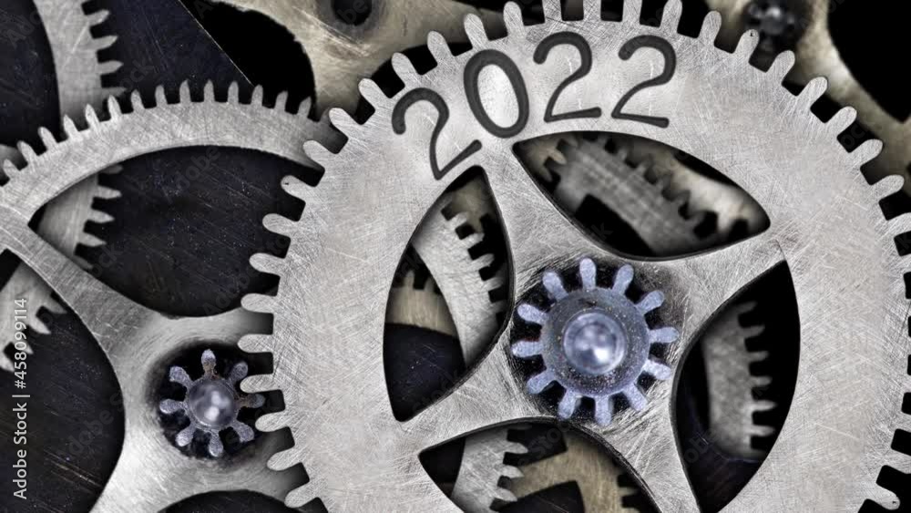 Rotating tooth wheel with New Year 2022 imprinted on metal surface. High quality 4k video. Rotating tooth wheel with New Year 2022 imprinted on metal surface. High quality 4k video.
