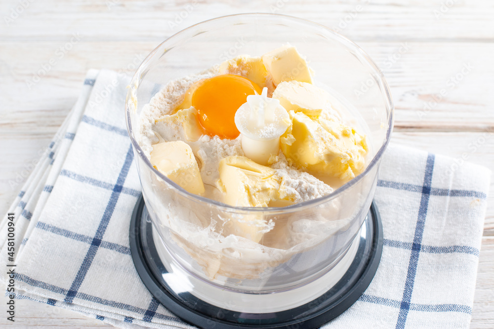 Pastry preparation, butter, eggs and flour in a food processor.