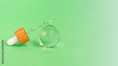Obraz na płótnie Closeup photography of the pipette with cosmetics gel inside,bubbly sructure