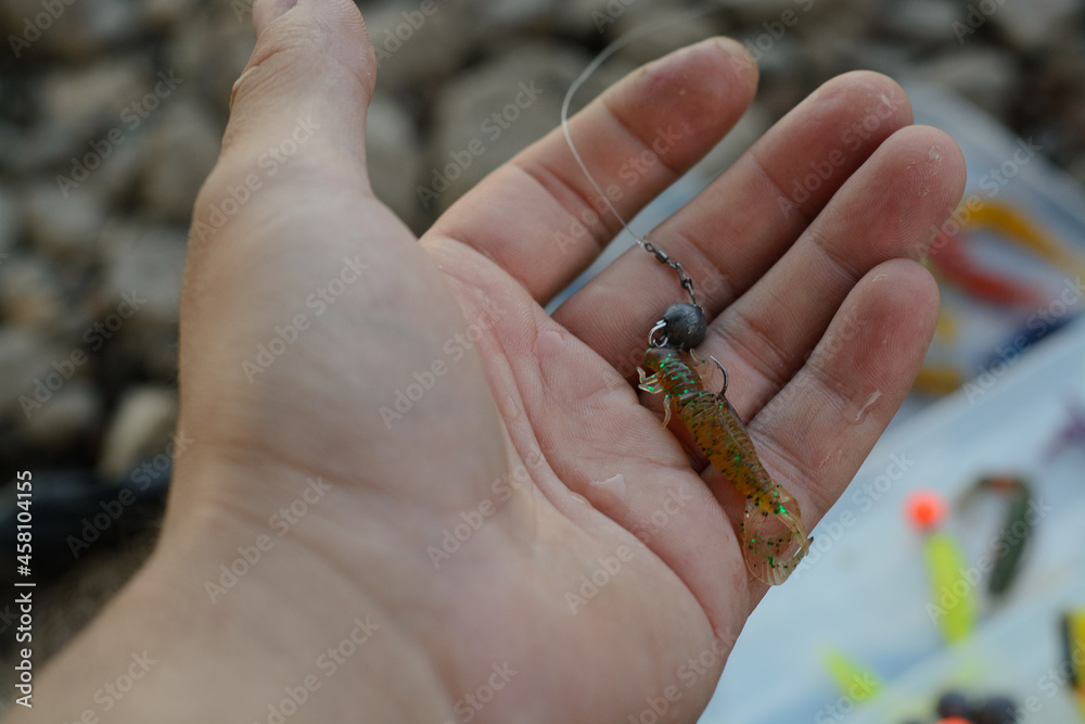 Obraz premium Bait for fishing in hand