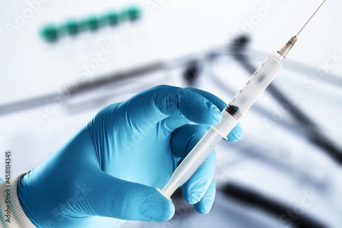 covid-19 coronavirus vaccination concept with medical syringe photo