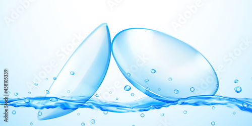 Realistic translucent contact lenses in light blue color with water flow, splash and drops