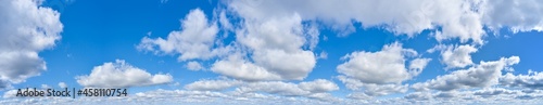 Large panorama of bright blue sky with clouds