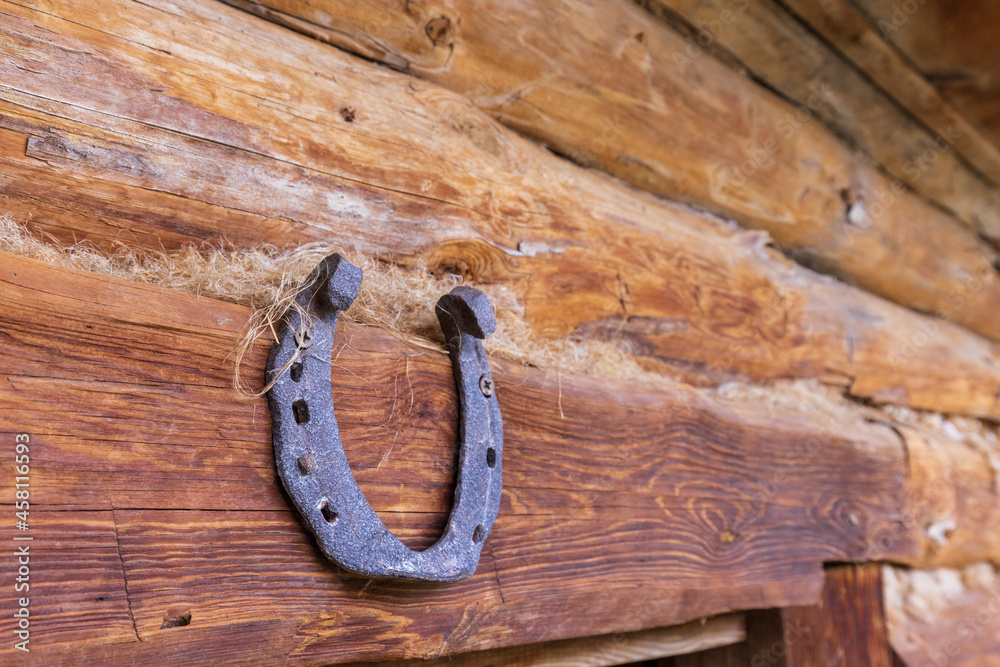 A horseshoe is nailed over the door for luck. A horseshoe is nailed over the door for luck.