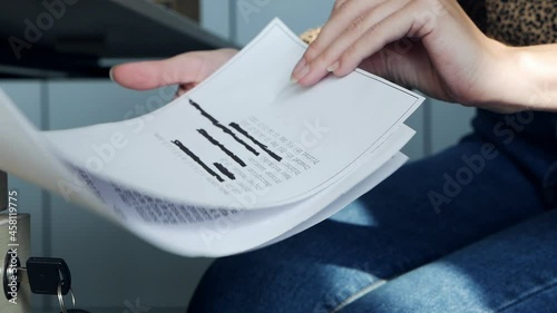 Hands open the closet and take information on a top secret document containing classified information