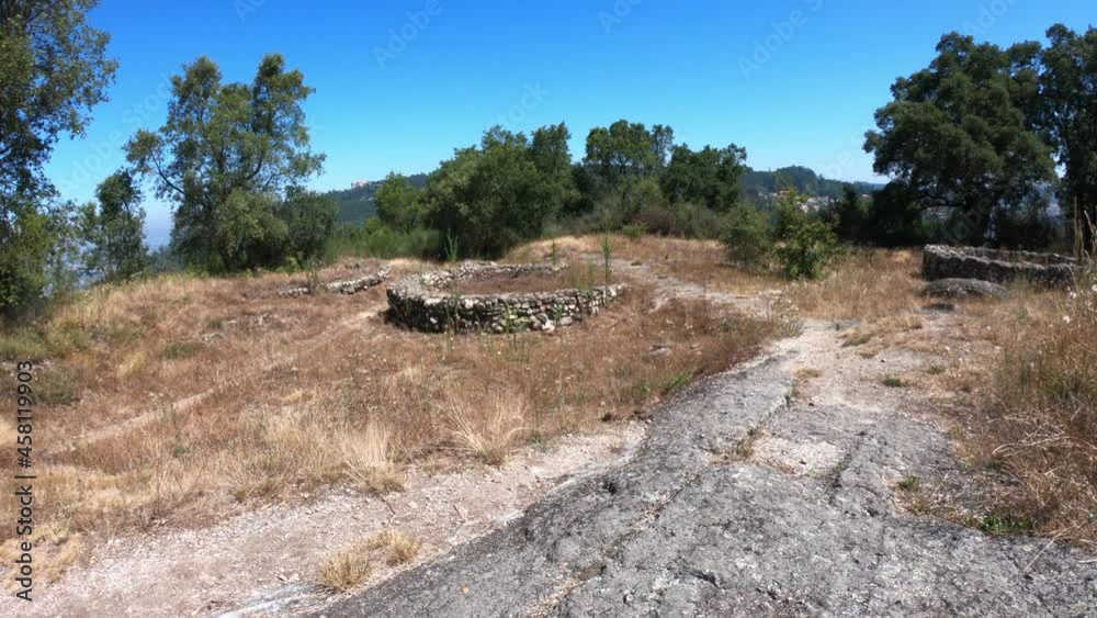 DRONE AERIAL FOOTAGE: The Padrao Mountain Roman Settlement, or Chester, also called Castro of Monte Padrao, built in the 9th century BC and active until the late Middle Ages, in Santo Tirso, Portugal.