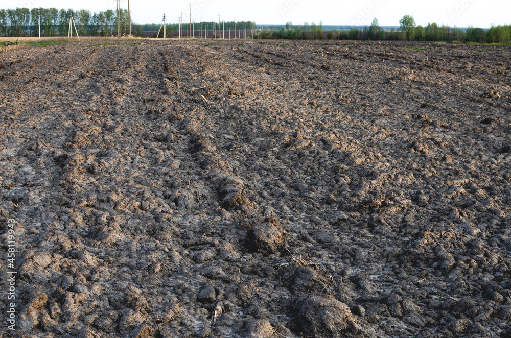 Fototapeta premium Plowed field ready for spring planting