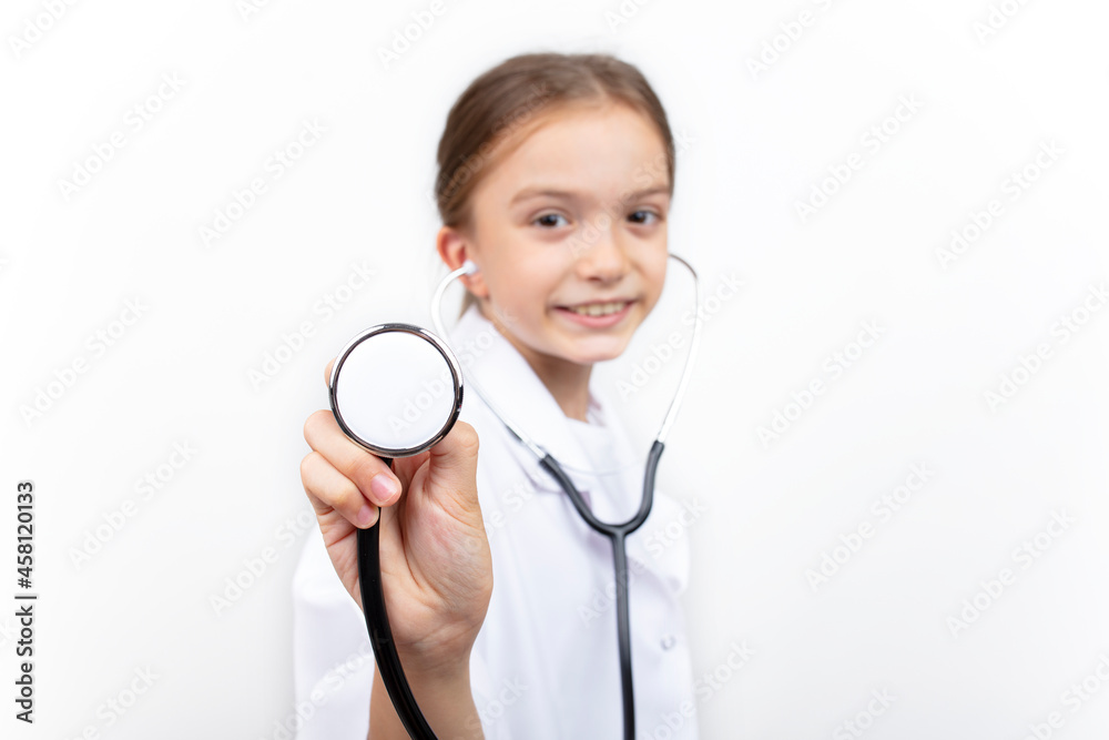 Portrait of a cute little girl dressed as a doctor with a stethoscope. Portrait of a cute little girl dressed as a doctor with a stethoscope.
