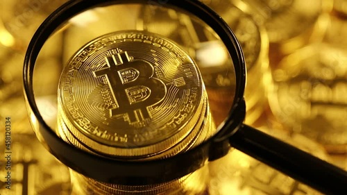 bitcoins under magnifying glass blockchain technology bitcoin mining concept crypto