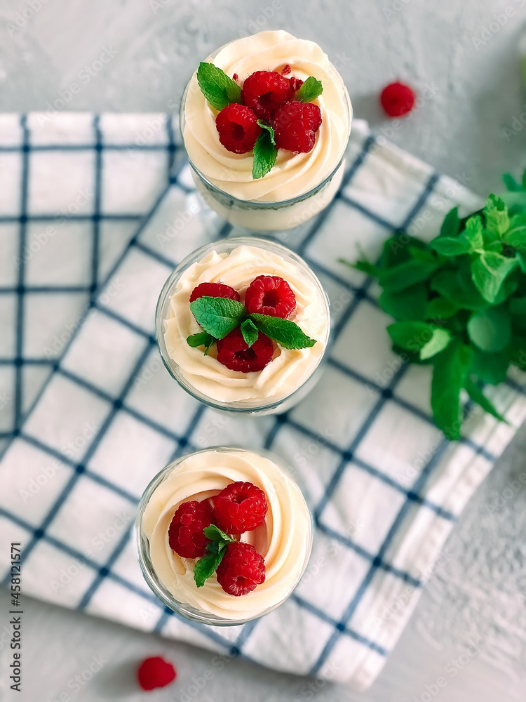 Sweet homemade trifle dessert with raspberries and cream cheese. Sweet homemade trifle dessert with raspberries and cream cheese.