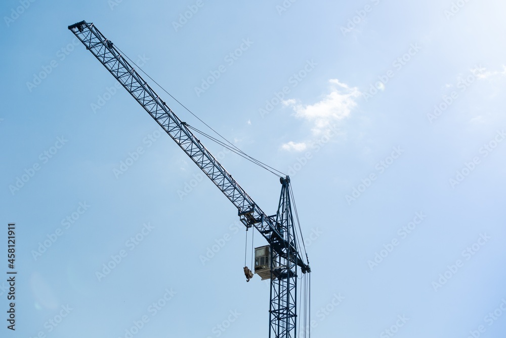 Building construction cranes on sky background