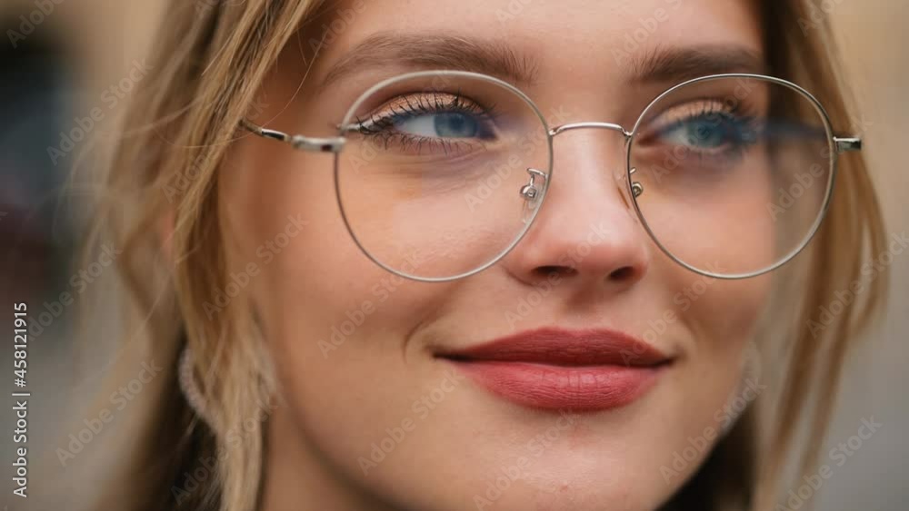 Portrait of attractive young girl in glasses. Happy and smiling girl feeling good. High quality 4k footage Portrait of attractive young girl in glasses. Happy and smiling girl feeling good. High quality 4k footage