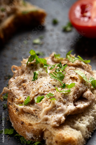 Pork pate on bread with herbs